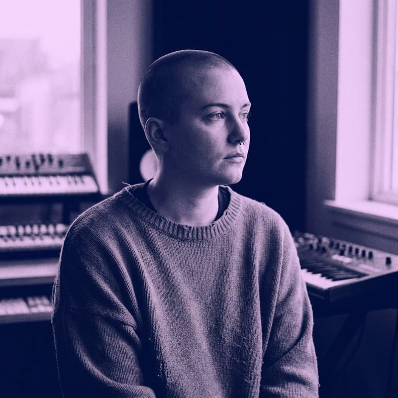 Duotone portrait of ambient composer Noor Amari, purple and deep navy.