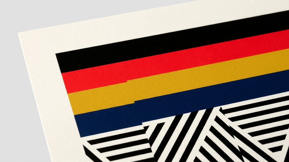 Abstract graphic: stacked horizontal bands of black, red, yellow, and navy.